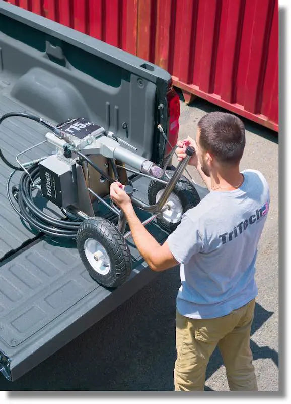 Pompe airless TriTech T15TX sur chariot mobile — vue latérale — Suisse